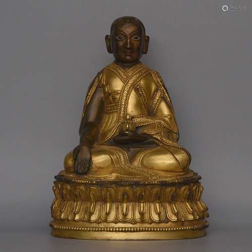 A GILT-BRONZE FIGURE OF BUDDHA