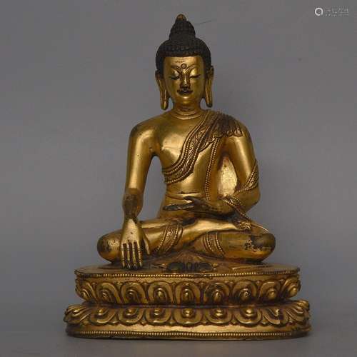 A GILT-BRONZE FIGURE OF SHAKYAMUNI