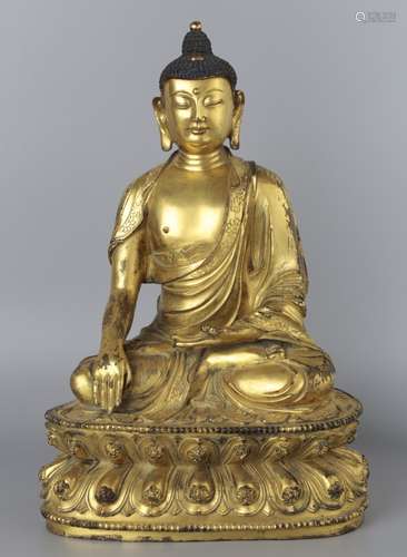 A GILT-BRONZE FIGURE OF SHAKYAMUNI