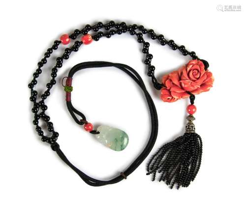 A NATURAL ORANGE-RED CORAL AND JADEITE NECKLACE