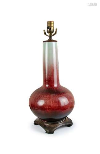 A CHINESE RED GLAZED PORCELAIN VASE LAMP