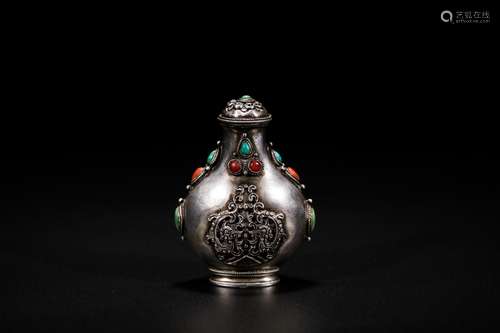 Chinese silver with inlaid stones snuff bottle.