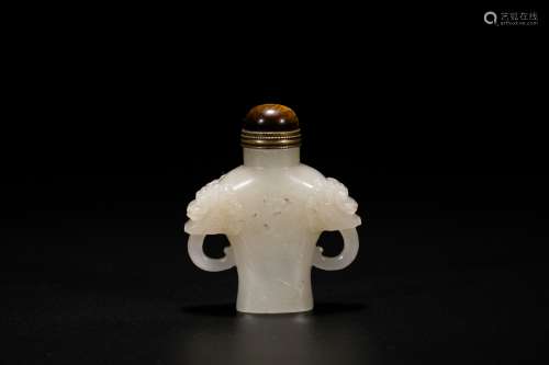 Chinese carved white jade snuff bottle.  19th Century.