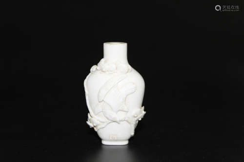 Chinese molded and carved porcleain snuff bottle