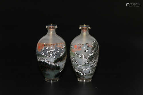 A pair of Chinese inside-painted glass snuff bottles.