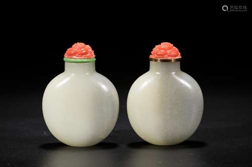 A pair of Chinese white jade snuff bottles. 19th