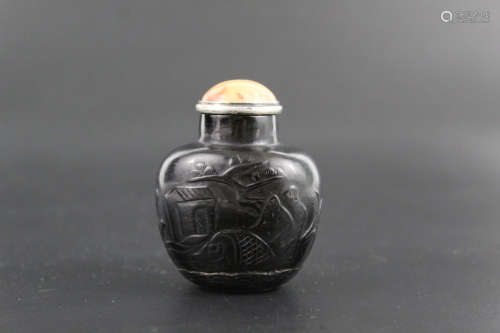 Chinese carved black glass snuff bottle