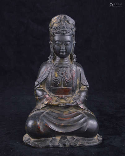 A BRONZE MOLDED GUANYIN STATUE