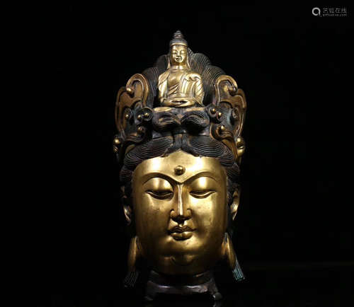 A GILT BRONZE MOLDED GUANYIN HEAD STATUE