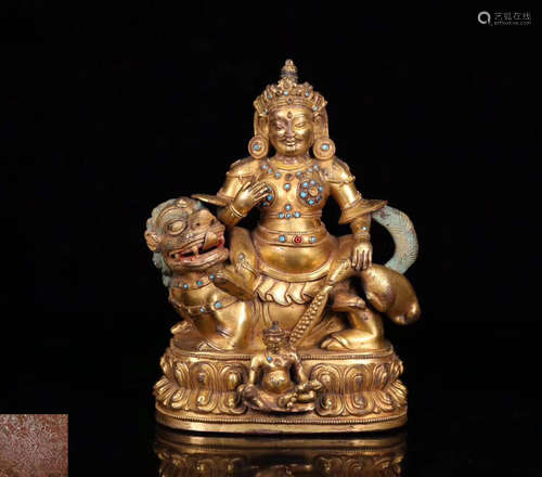 A GILT BRONZE MOLDED BUDDHA STATUE