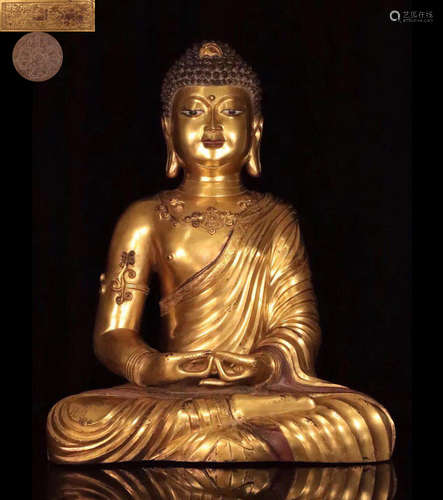 A GILT BRONZE MOLDED SHAKYAMUNI BUDDHA STATUE