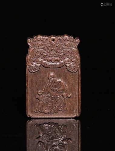 A CHENXIANG WOOD CARVED CHARACTER STORY PENDANT