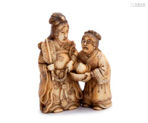 AN IVORY NETSUKE OF SEIŌBO WITH AN ATTENDANT WITH ...