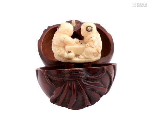 A WOOD AND IVORY NETSUKE OF TWO KARAKO PLAYING GŌ ...