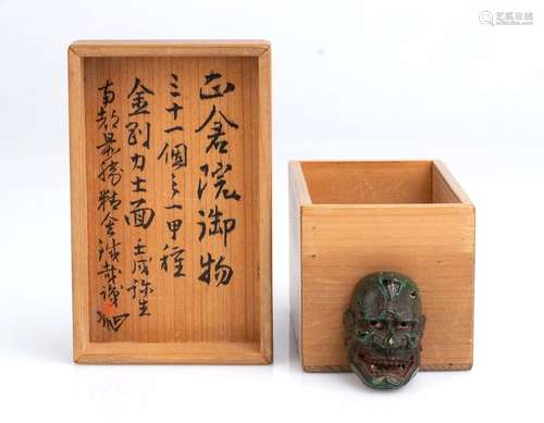 A LACQUERED WOOD NETSUKE OF GIGAKU MASK AND JAPANE...