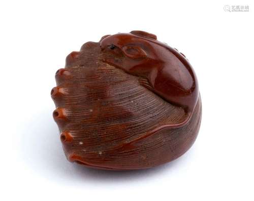 A WOODEN AND HORN INLAID NETSUKE OF A MOUSE ON AN ...