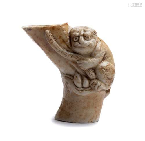 A GLAZED CERAMIC NETSUKE OF A TIGER AND BAMBOO 19t...