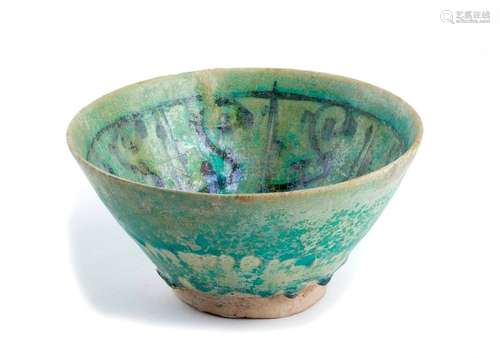 A TURQUOISE GLAZED PAINTED BOWL Iran, 11th–12th ce...