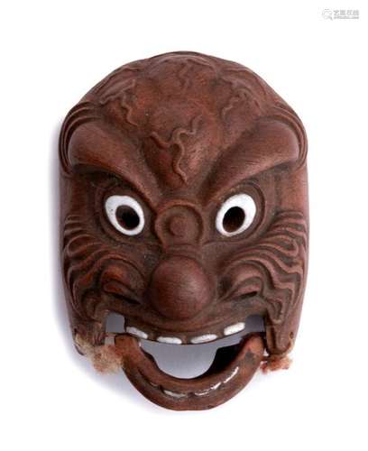 A PAINTED CERAMIC NETSUKE OF A MASK Gifu, first ha...