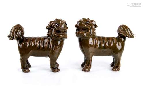 A PAIR OF GREEN GLAZED BUDDHIST LIONS China, 20th ...