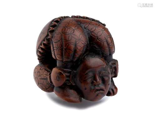 A WOOD NETSUKE OF A CONTORTIONIST 19th century uns...