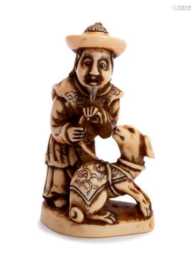 AN IVORY NETSUKE OF A CHINESEMAN AND DOG first hal...