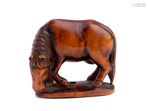 A WOOD NETSUKE OF A GRAZING HORSE 19th century uns...