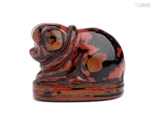 A LACQUERED WOOD NETSUKE OF A PUPPY 19th century u...