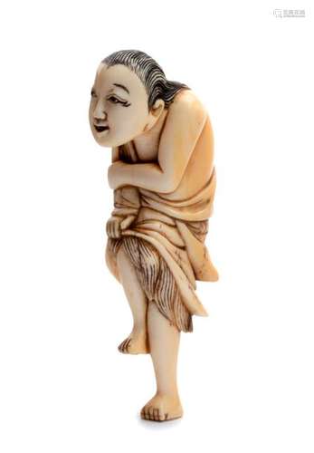 AN IVORY NETSUKE OF A STANDING DIVING GIRL early 1...