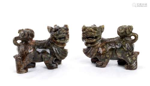 A PAIR OF GREEN STONE BUDDHIST LIONS China, 20th c...