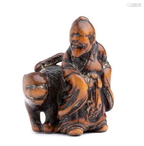 A WOOD NETSUKE OF BUNKAN WITH THE TIGER early 19th...