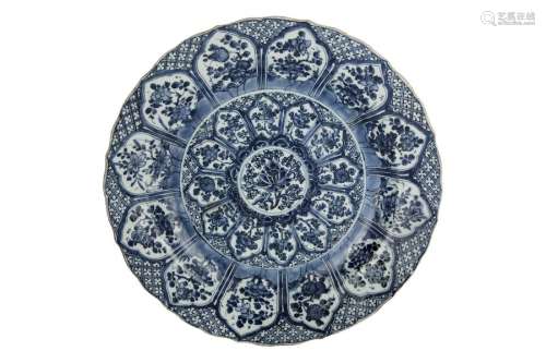A LARGE BLUE AND WHITE DISH WITH BARBED RIM China,...