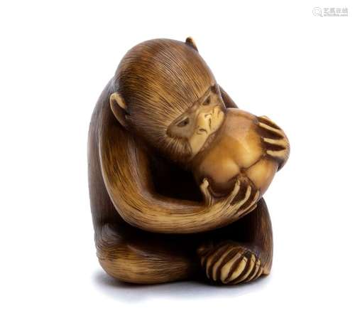 AN IVORY NETSUKE OF MONKEY EATING A PERSIMMON Kyot...