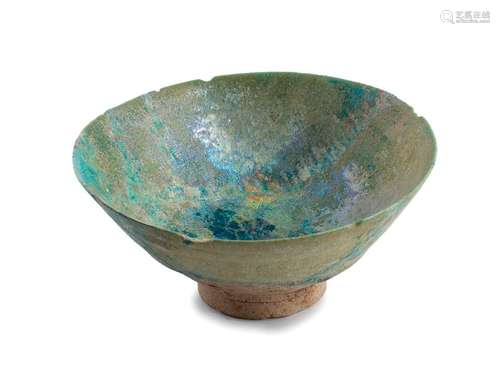 A TURQUOISE GLAZED BARBED RIM BOWL Iran, 12th cent...