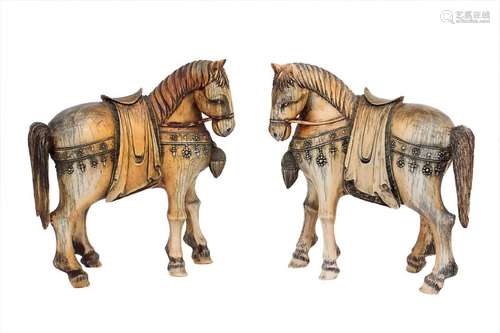 A PAIR OF IVORY CARVING OF HORSES China, early 20t...