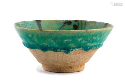 A TURQUOISE GLAZED PAINTED BOWL Iran, Gurgan, 12th...