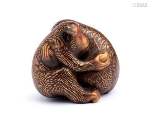 A LACQUERED AND GILT WOOD NETSUKE OF TWO MONKEYS s...