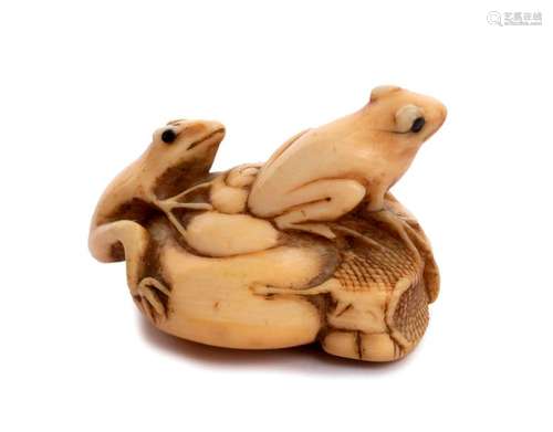 AN HORN INLAID IVORY NETSUKE OF A SNAIL AND TWO FR...