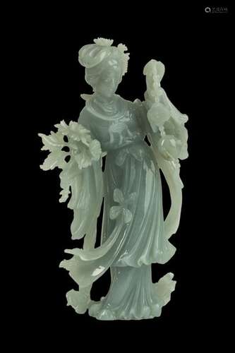 A JADEITE CARVING OF A STANDING LADY China, 20th c...