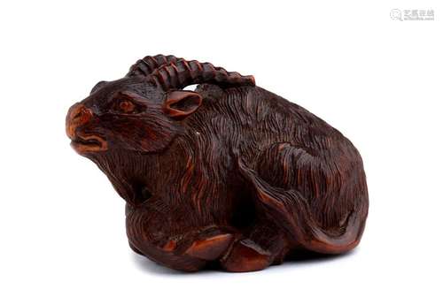 A WOOD NETSUKE OF A GOAT Ise, early 19th century s...