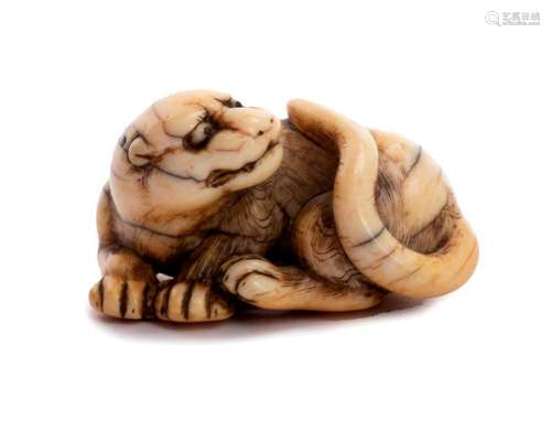 AN IVORY NETSUKE OF TIGER Kyoto, second half of th...