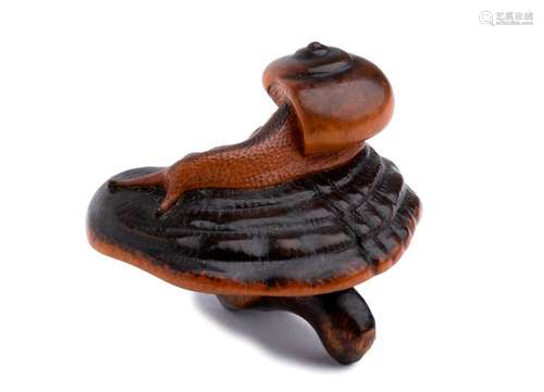 A WOOD NETSUKE OF A SNAIL ON A REISHI FUNGUS 19th ...