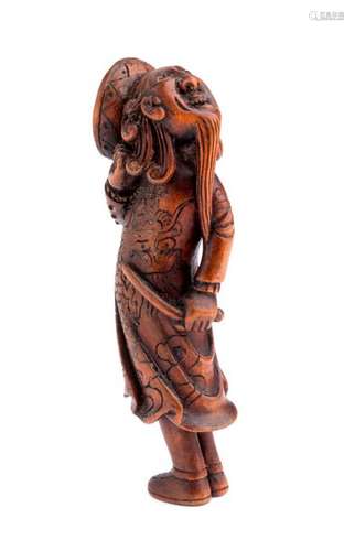 A HORN INLAID WOOD NETSUKE OF A FOREIGNER 18th 19t...