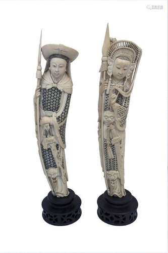 A PAIR OF IVORY CARVINGS OF STANDING FEMALE SOLDIE...