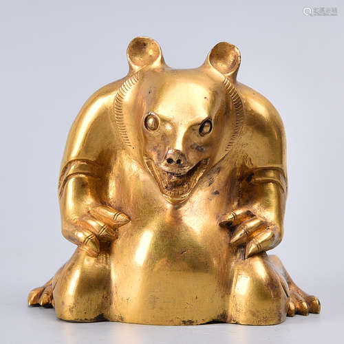 A GILT BRONZE PAPER WEIGHT