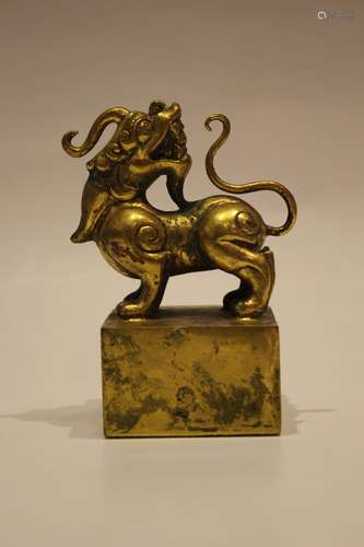 A GILT BRONZE BEAST SEAL