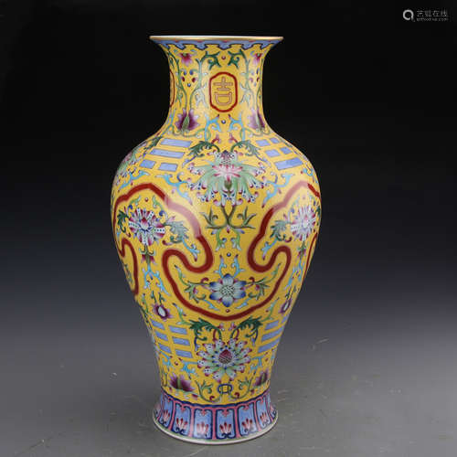 QIANLONG MARK, A GILT FAMILLE ROSE GUANYIN VASE