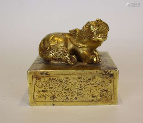 A GILT BRONZE BEAST SEAL