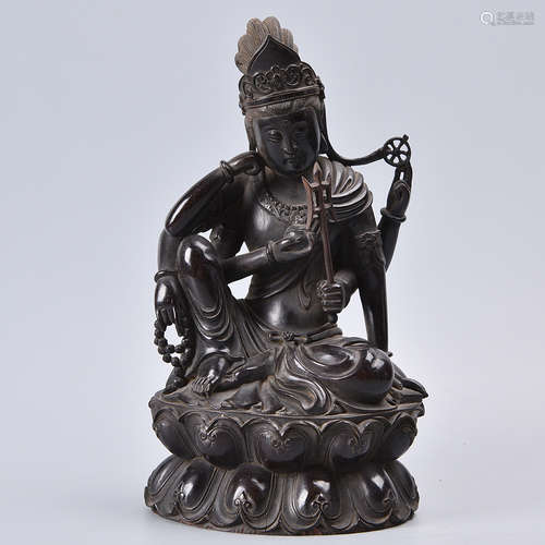 A CARVED ROSEWOOD GUANYIN STATUE