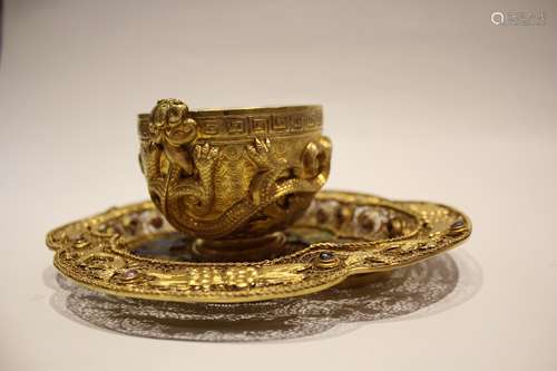 A GILT SILVER CUP WITH STAND